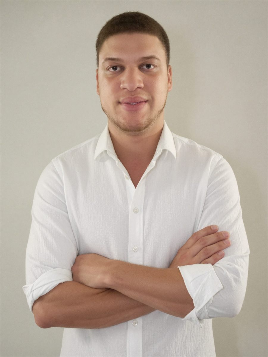 Jacob Clark, founder of BRIDGEVANTI, standing with arms crossed